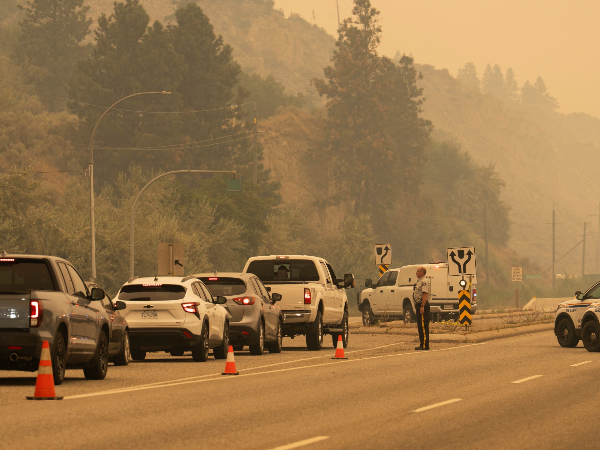 British Columbia wildfire forces more than 20,000 to flee, destroys homes | Climate Crisis News