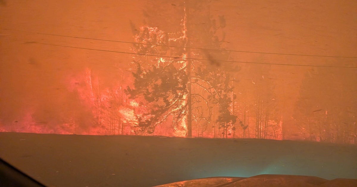 Fast-moving wildfire in western Canada forces more than 20,000 people to evacuate