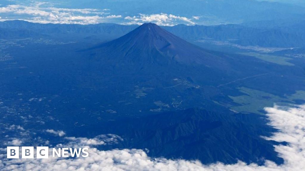 Father leaves 7-year-old son alone on Mount Fuji to continue hike, reports say - BBC