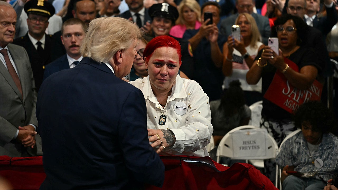 President Donald Trump exits speech stage to hug Jacob Freytes' grieving parents