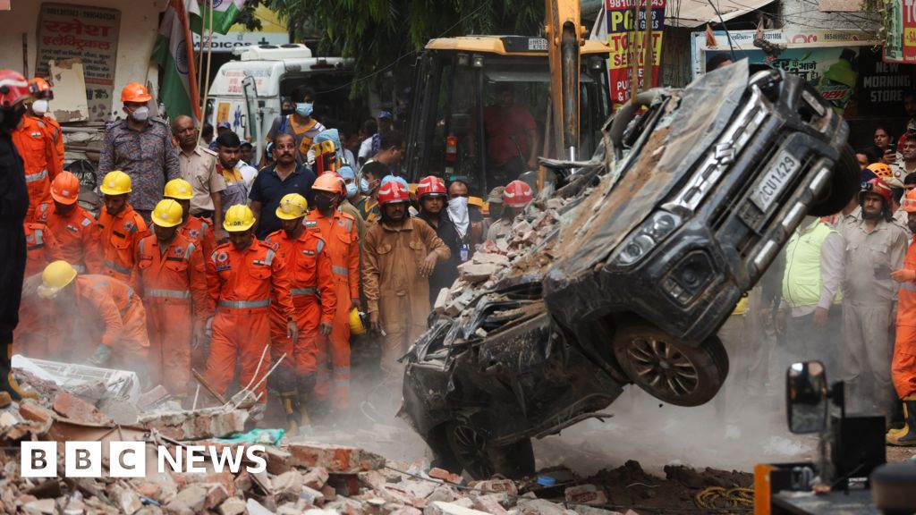 Dozens feared trapped in collapsed building in Delhi - BBC