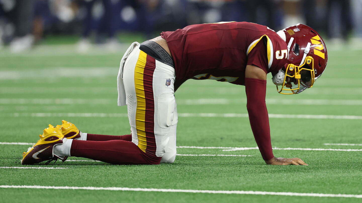Jayden Daniels injures left arm on final play of half as Cowboys lead 17-10