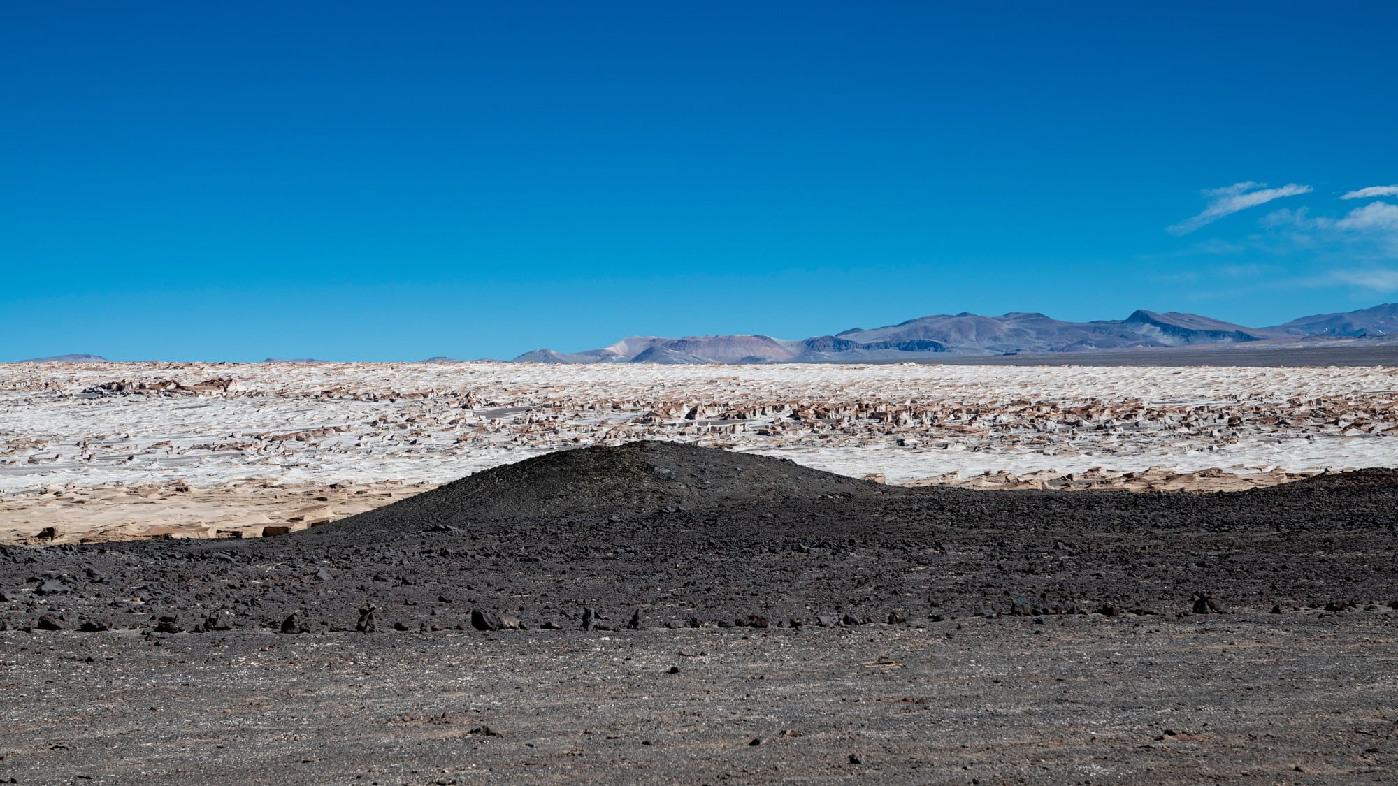 On the dwarf planet Ceres, a lone mountain called Ahuna Mons rises four kilometres from an otherwise flat, cratered plain, built not from lava but from erupting salty brine that froze solid.