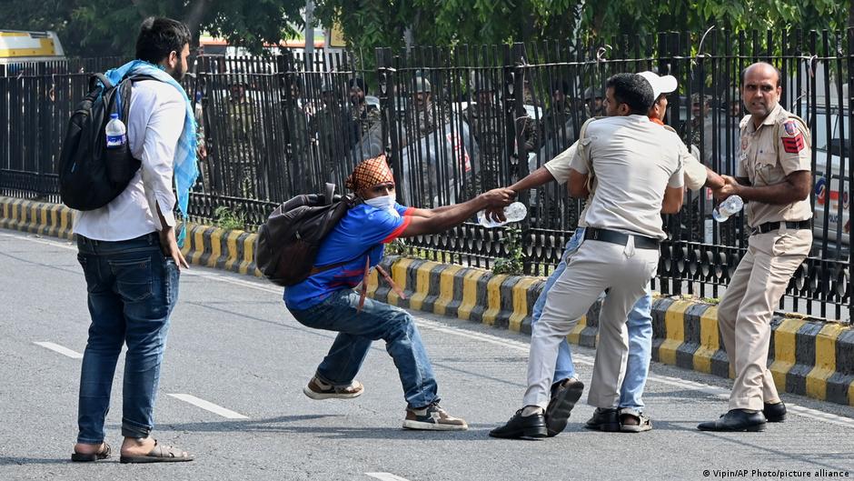 Indian police crack down on 'Cockroach' protest in Delhi