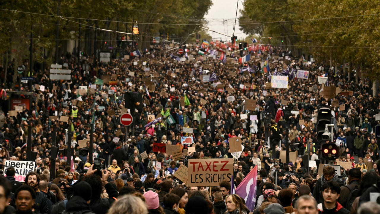 Live: Police say 110,000 turn out for 'calm' Paris protest, reports of clashes in other cities