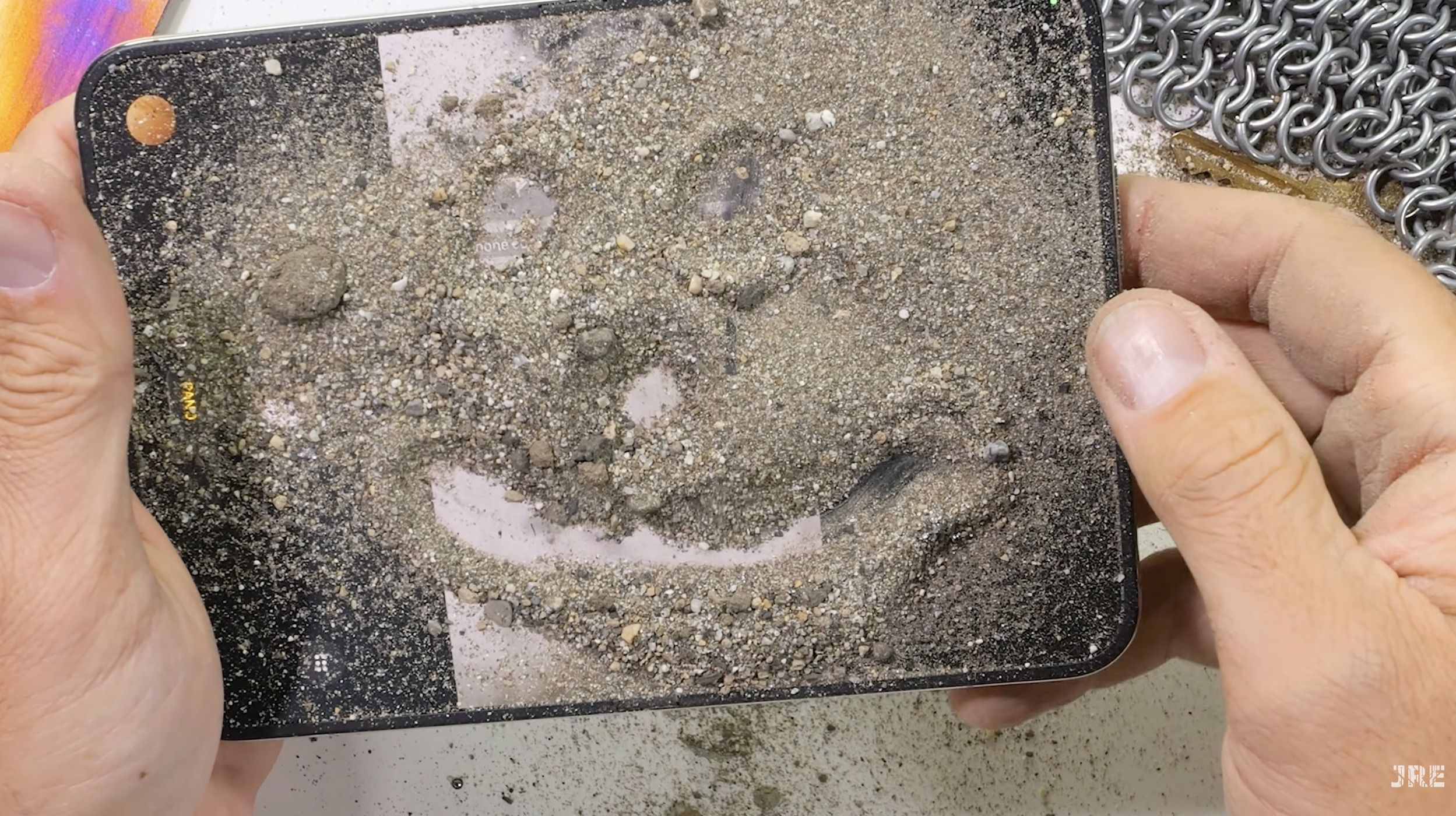 iPhone Duo Fails JerryRigEverything's Dusty Durability Test